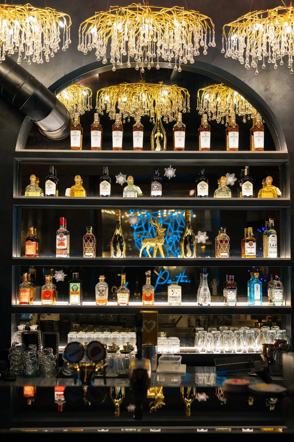 The lit bottle wall under the crystal