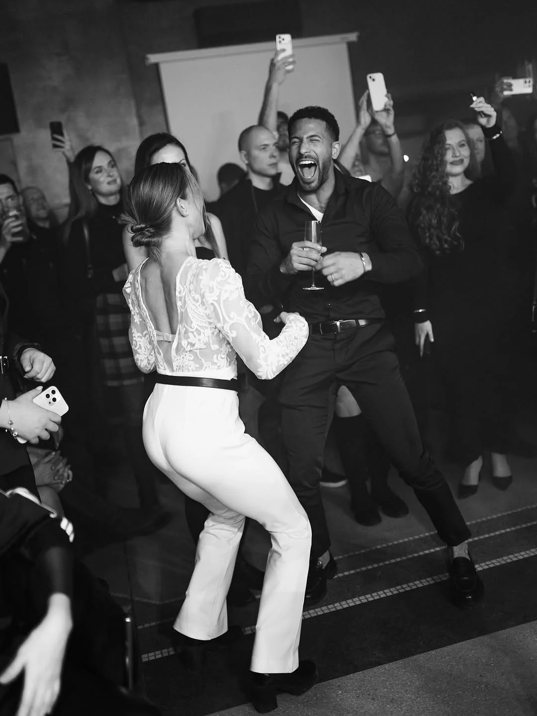 Guests dancing while the room films it